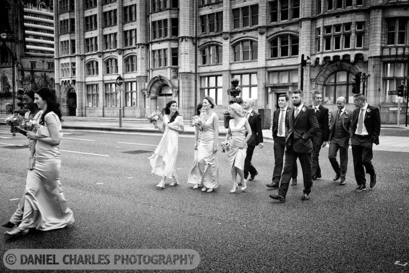 bridal party crossing liverpool road. black and white wedding photography