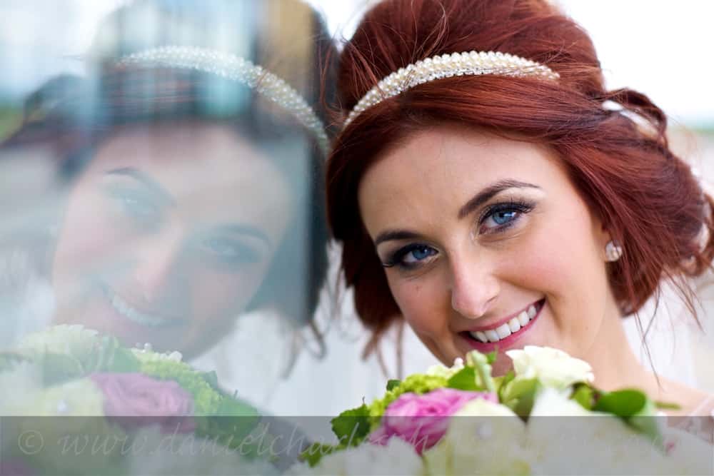 portrait of bride reflected in glass