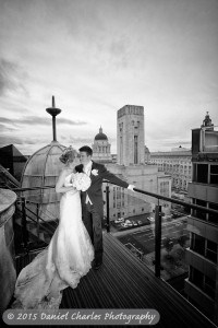 bride and groom standing together on balcony of 30 james street